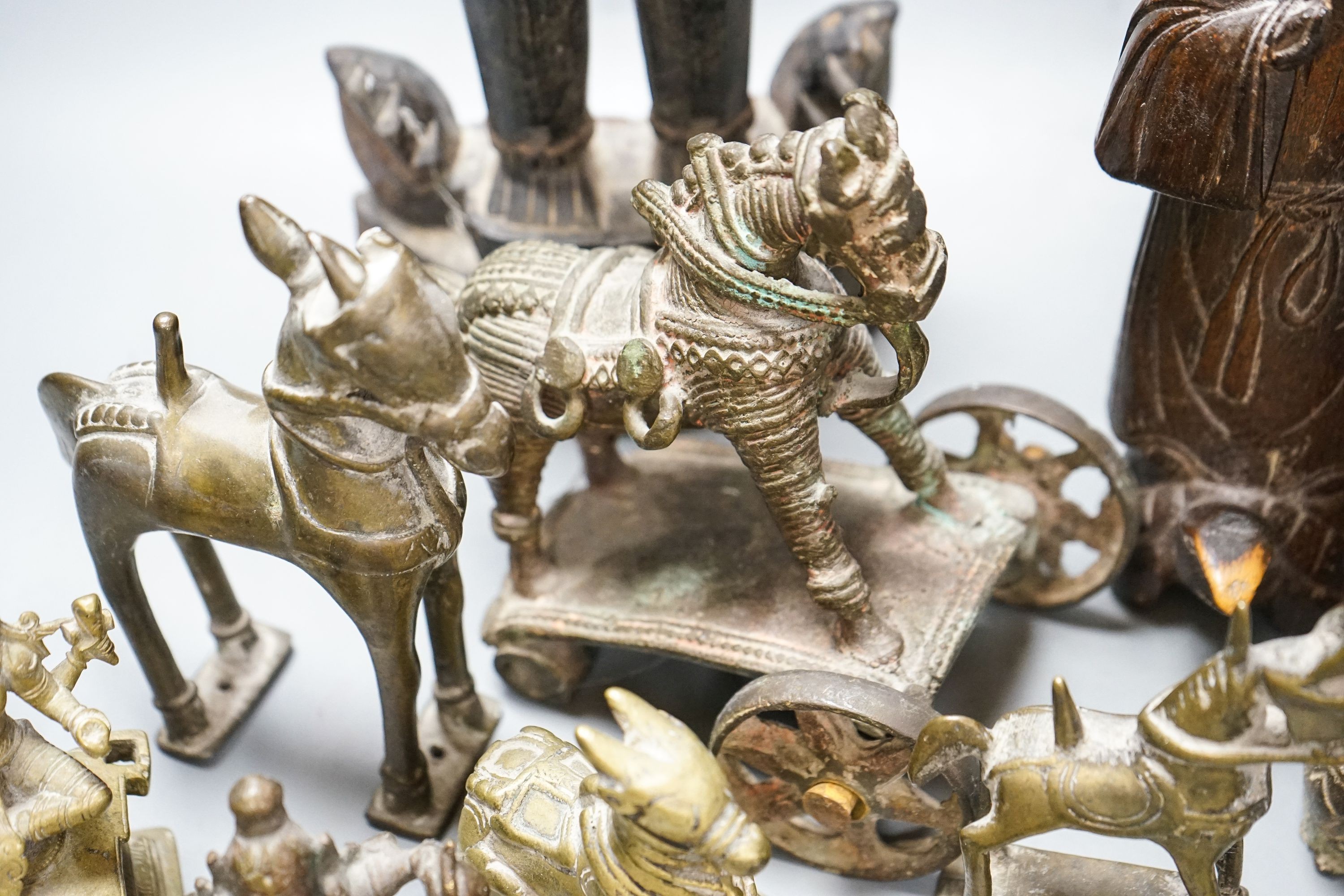 A group of Indian brass and wood figures and a Chinese wood figure